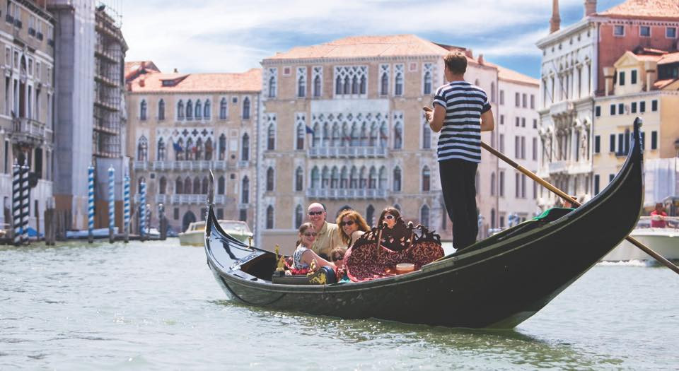 Take a gondola ride through the canals in Venice, Italy
